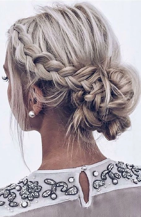 Chic prom look combining Dutch braid with soft curls for a stylish finish Elegant prom hairstyle featuring a Dutch braid woven into a loose updo