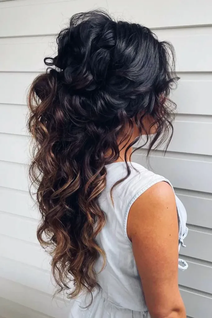 Stunning curly half up half down look perfect for prom night glamour Elegant half up half down prom hairstyle with soft curls and delicate accessories