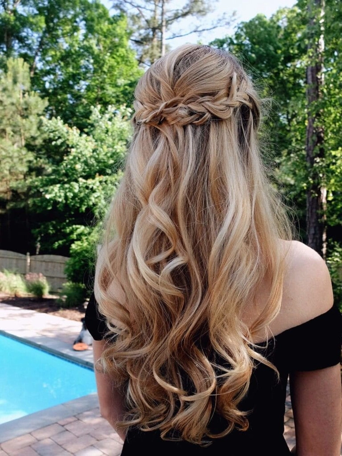 Elegant long prom hairstyle showcasing natural curly hair with soft waves