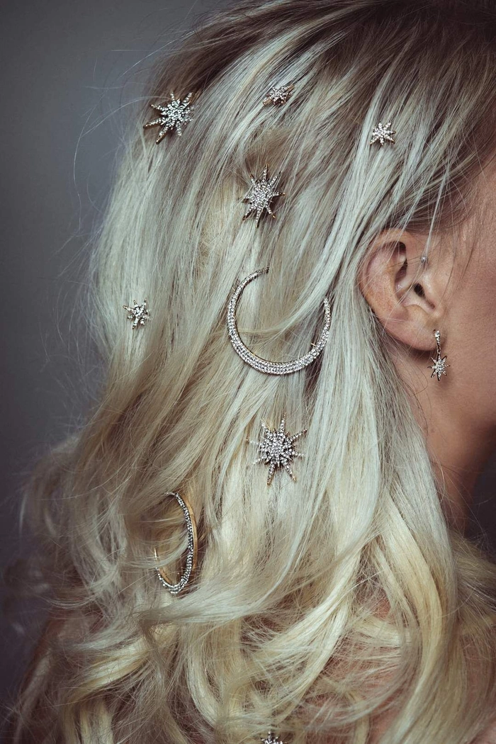 Elegant prom hairstyle featuring jeweled hair cuffs woven into braided locks