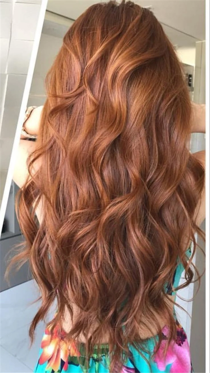 Elegant prom hairstyle showcasing beautiful copper ginger hair with loose curls