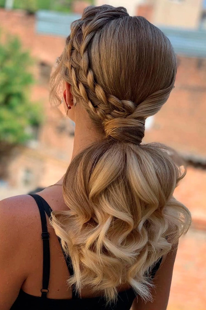 Stunning Dutch braid hairstyle perfect for prom night glamor Elegant prom hairstyle featuring a Dutch braid woven into loose curls