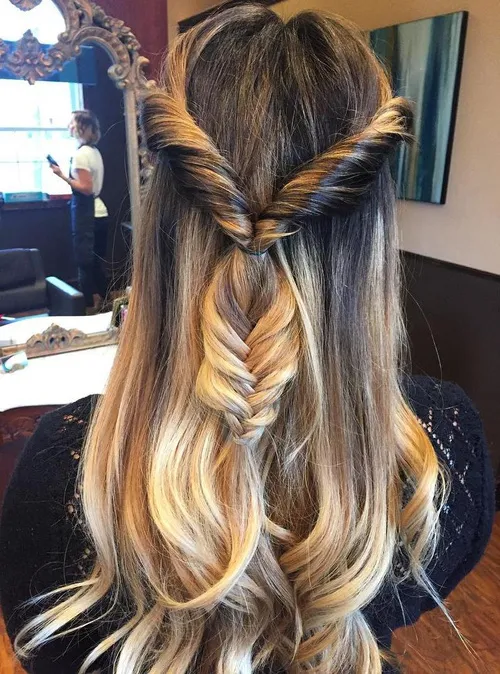 Prom hairstyle featuring an elegant fishtail braid