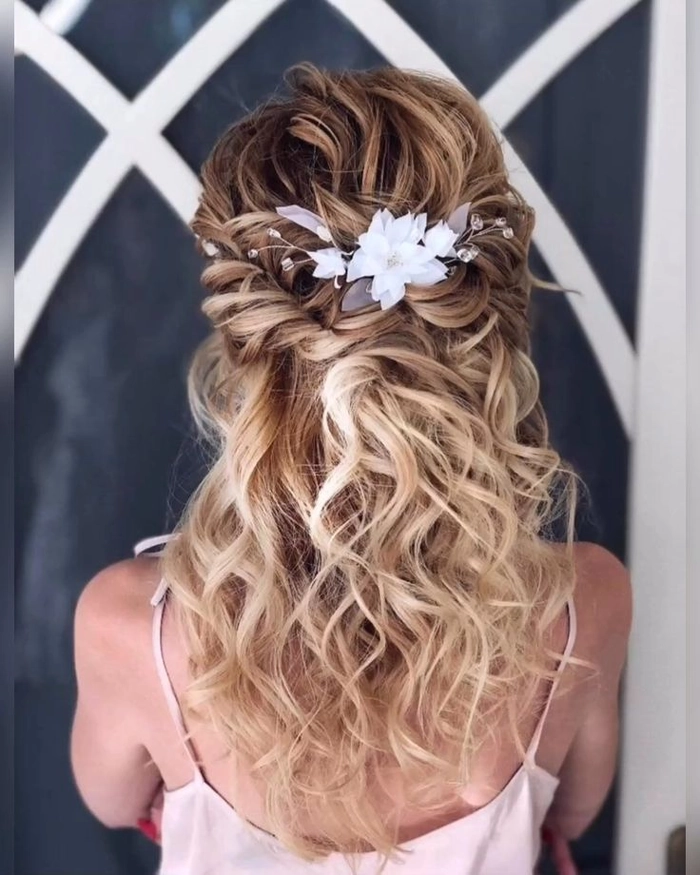 Beautiful prom hair inspiration featuring floral vine accessories Elegant prom hairstyle adorned with delicate floral hair vines