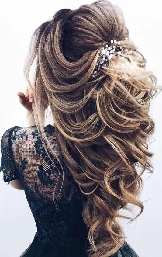 Chic updo idea for prom at an outdoor garden location Elegant prom hairstyle with floral accents perfect for a garden venue