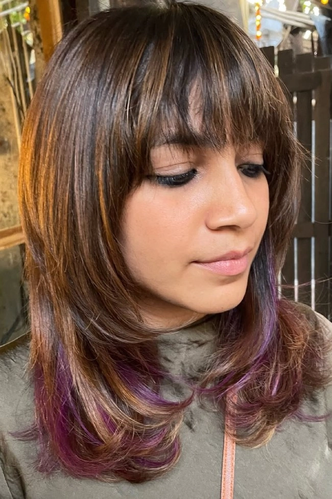 Stylish prom look with curtain fringe and soft bangs for a stunning finish Elegant prom hairstyle featuring bangs and curtain fringe on long hair