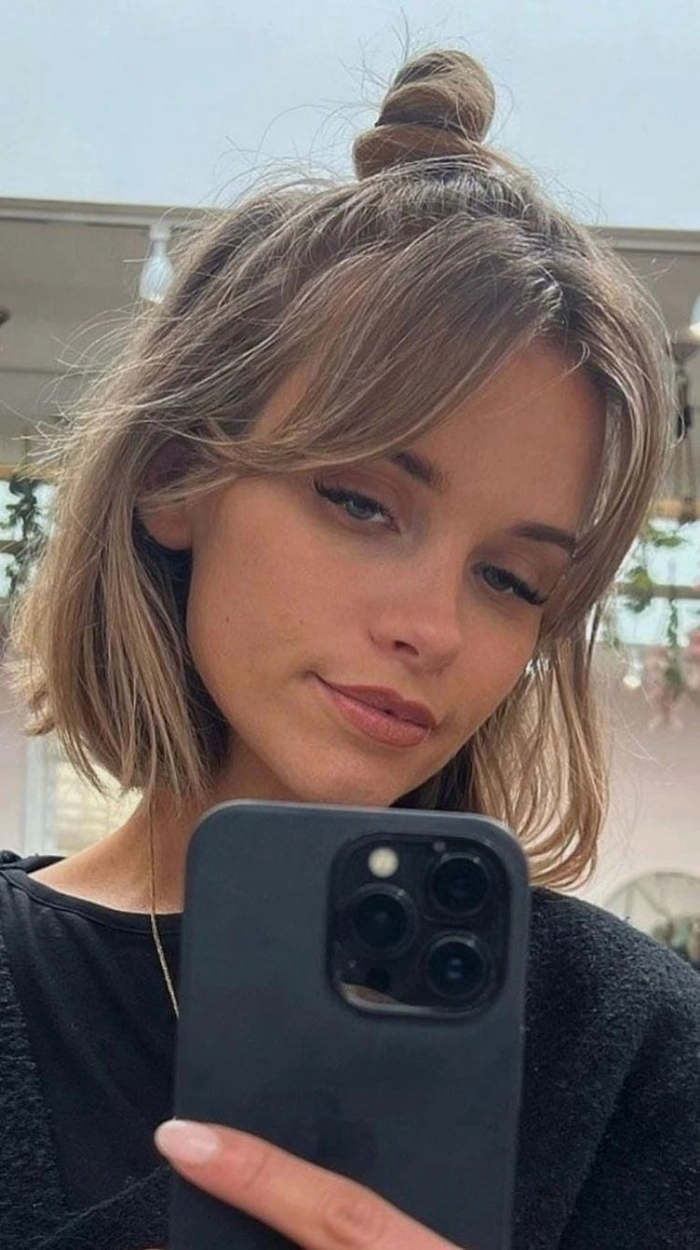 Prom hairstyle idea with bangs and curtain fringe for a memorable prom night Elegant prom hairstyle featuring bangs and a curtain fringe for a sophisticated look