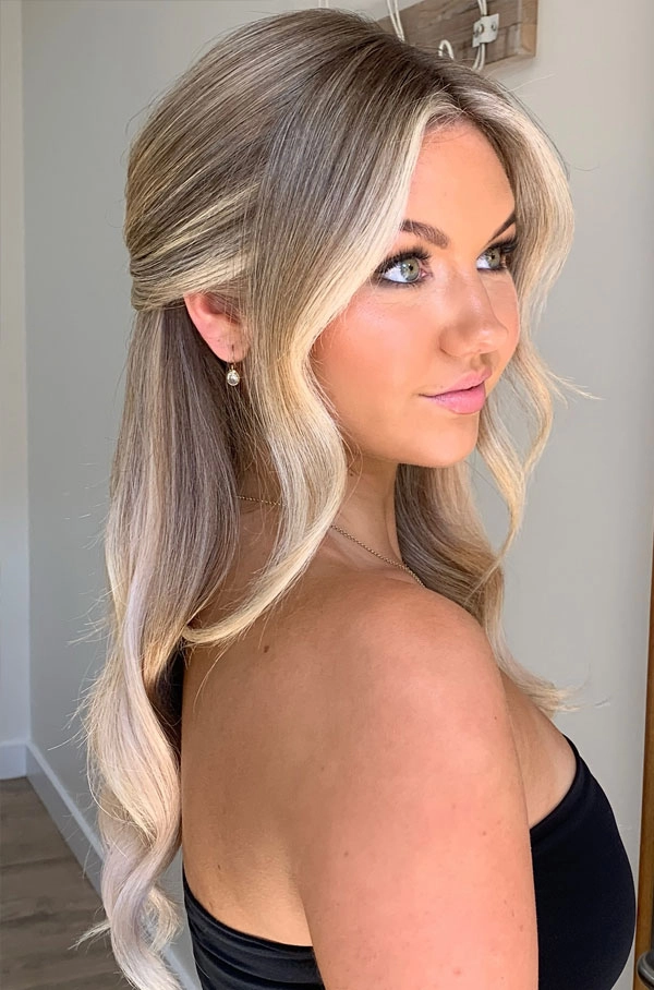 Elegant prom hairstyle with curls designed to complement a white dress