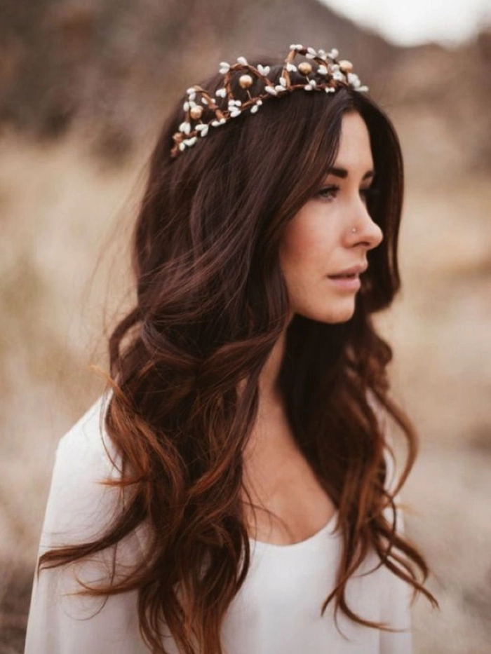 Sophisticated prom look with a subtle tiara for a graceful finish Elegant prom hairstyle featuring a delicate tiara adorned with small crystals