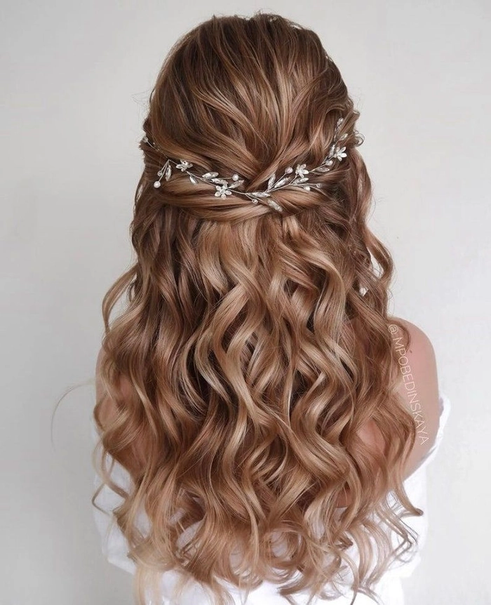 Prom Hairstyles with Floral Hair Vines Inspiration Image 13 Elegant prom hairstyle adorned with delicate floral hair vines for a romantic look