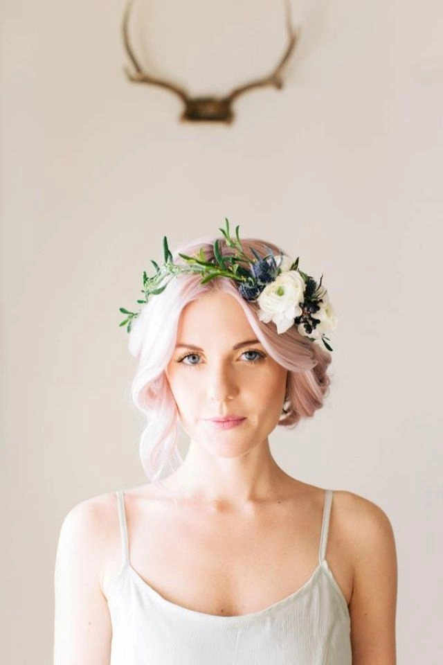 Elegant prom hairstyle featuring fresh flower crowns with soft curls
