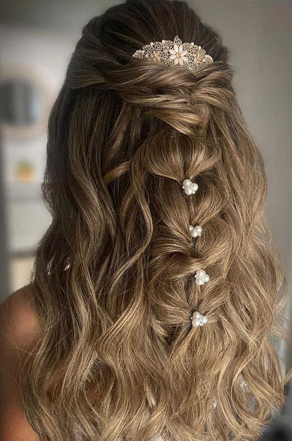 Elegant prom hairstyle adorned with delicate fresh flower crowns