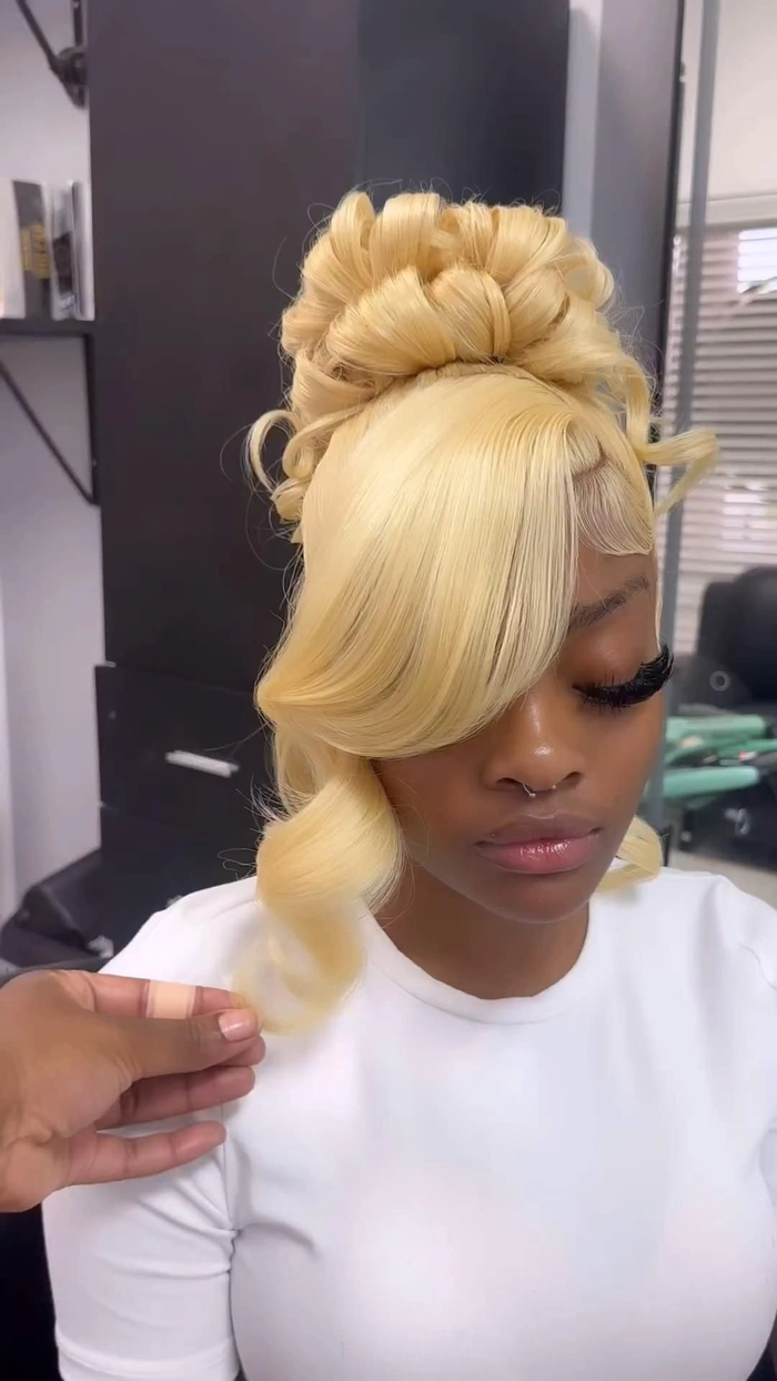 Elegant prom hairstyle featuring hair extensions and weaves for added volume and length