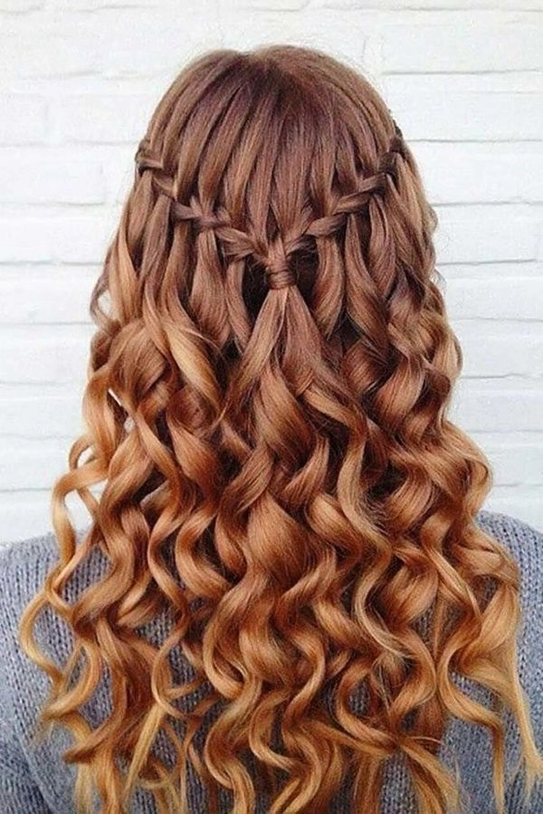 Sophisticated prom hairstyle perfect for a pageant look and feel Elegant pageant style prom hairstyle with intricate curls and volume