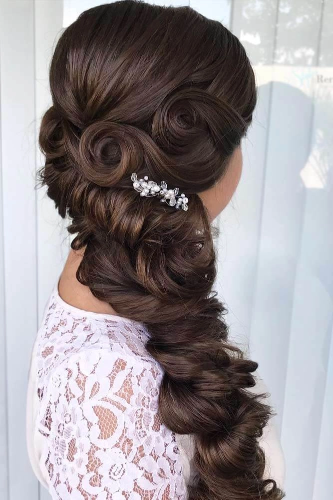Elegant prom hairstyle adorned with sparkling jeweled hair cuffs for a glamorous look
