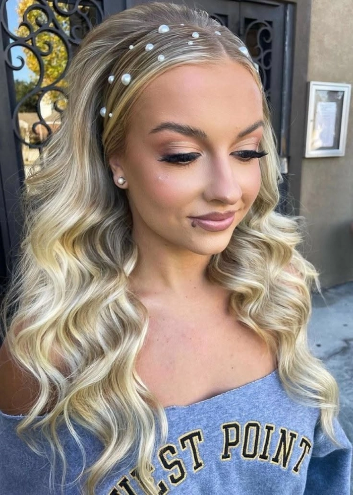 Elegant prom hairstyle featuring jeweled hair cuffs and soft curls