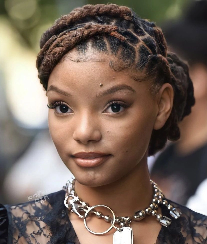 Elegant prom hairstyle for locs and dreadlocks with intricate twists and beads