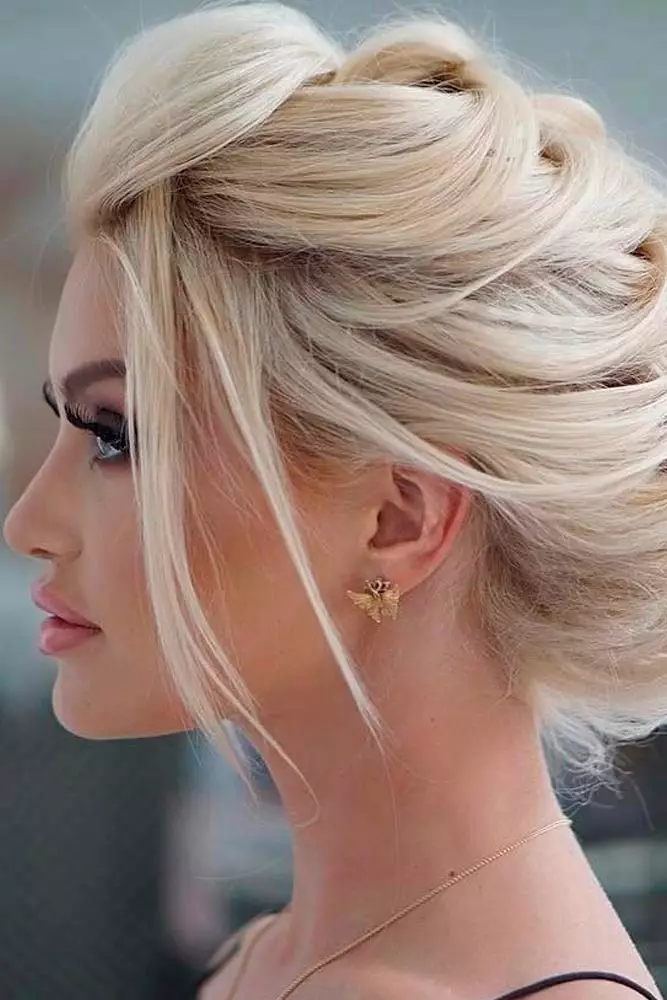 Sophisticated prom look featuring voluminous curls on thick long hair Elegant prom hairstyle for long thick heavy hair with soft curls and volume