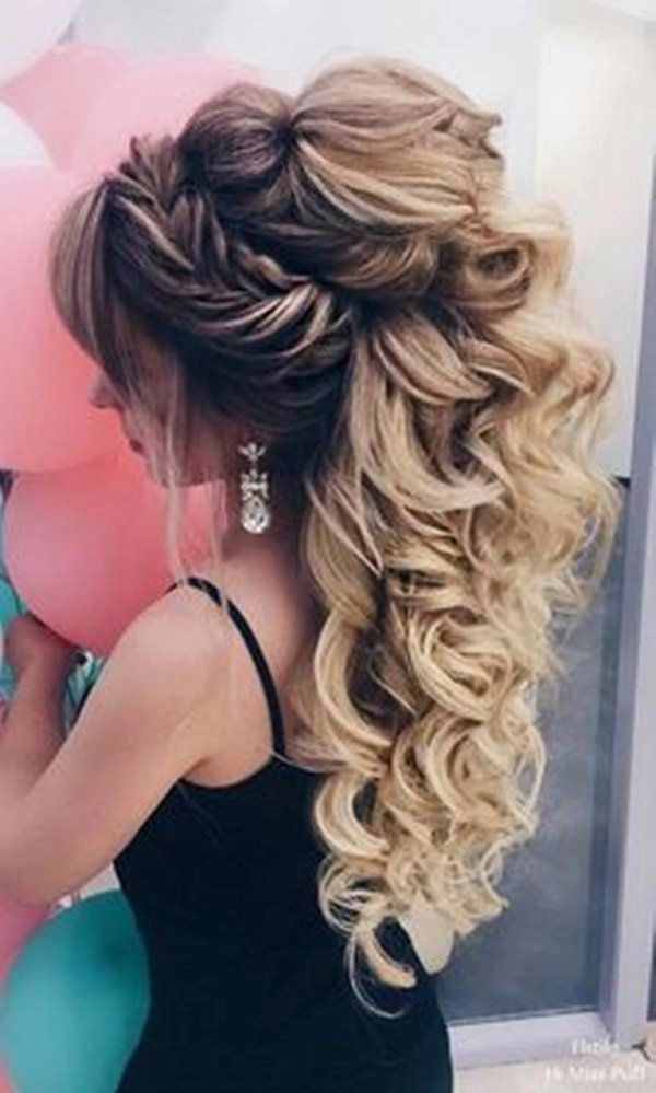 Stunning prom look featuring voluminous curls for thick hair Elegant prom hairstyle for long thick heavy hair with soft curls