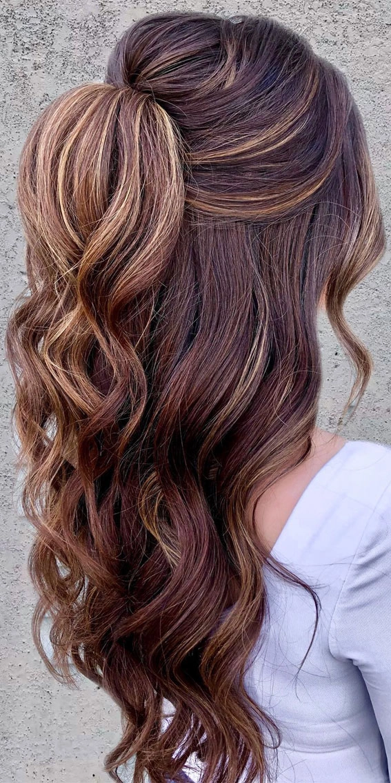 Chic prom look highlighting middle part hairstyles with volume and shine Elegant prom hairstyle featuring a sleek middle part with soft curls