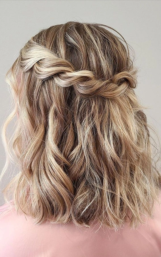 Sophisticated prom hairstyle with a classic middle part for a timeless look Elegant prom hairstyle featuring a middle part with soft waves