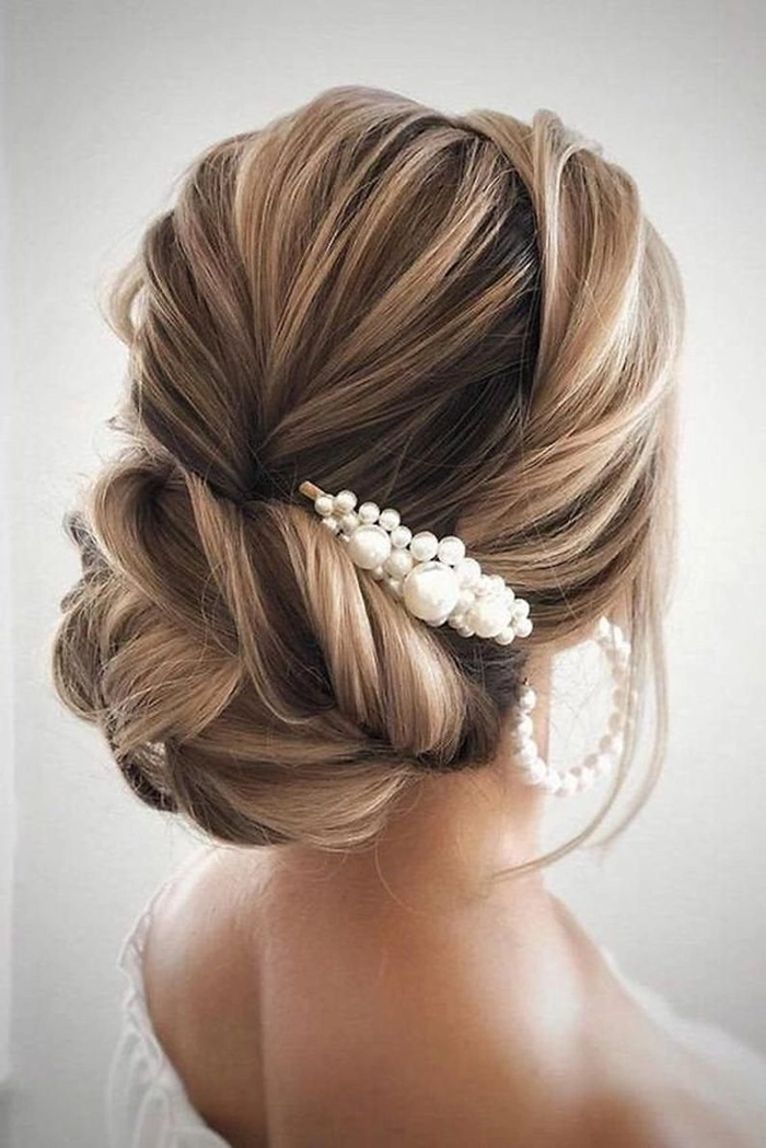 Elegant prom hairstyle featuring pearl hair accessories for a sophisticated look