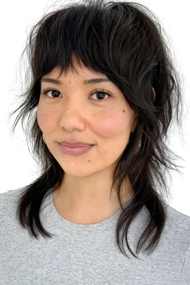Elegant prom hairstyle adorned with delicate pearl hair accessories
