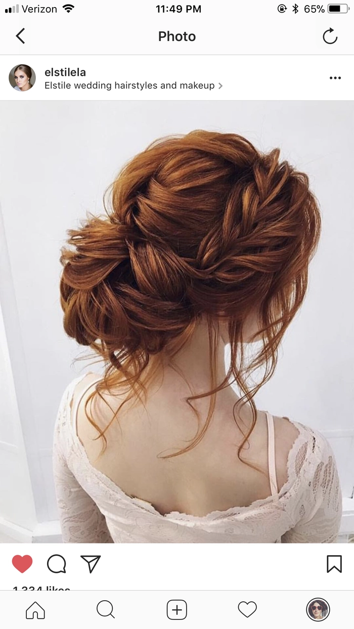 Elegant prom hairstyle showcasing vibrant red hair with intricate curls and braids