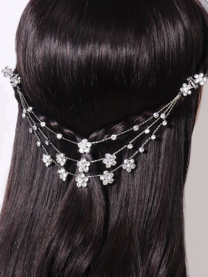 Elegant prom hairstyle featuring rhinestone hair clips for a sparkling finish