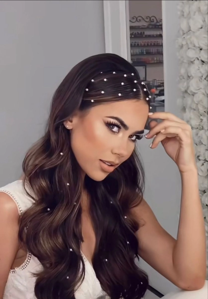 Elegant prom hairstyle featuring sparkling rhinestone hair clips
