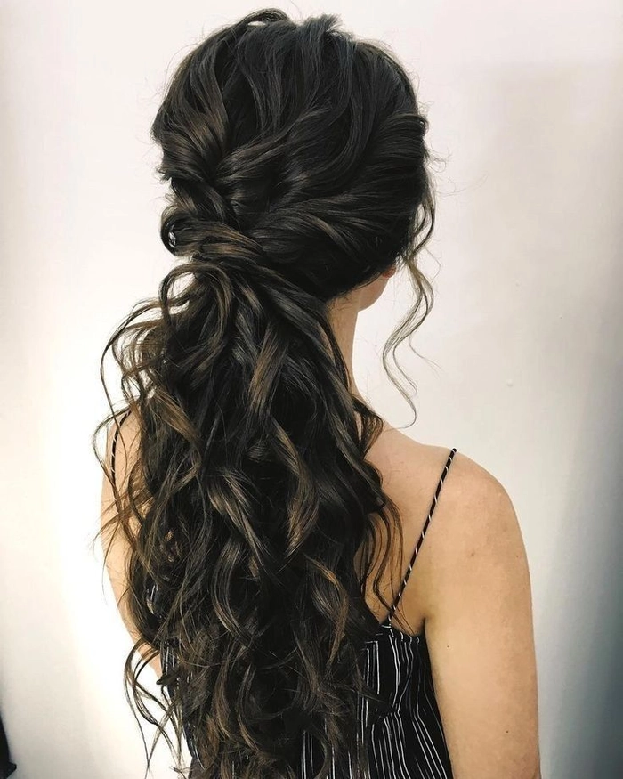 Elegant prom hairstyle showcasing soft curls for sweetheart neckline gowns
