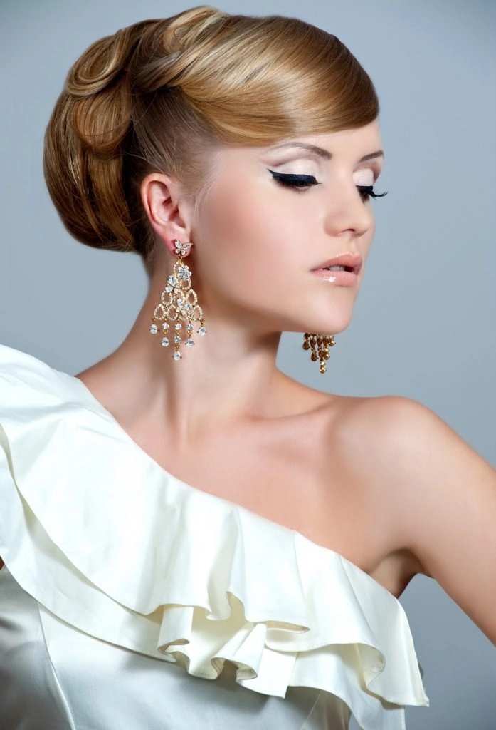 Elegant prom hairstyle showcasing soft curls for one shoulder gowns