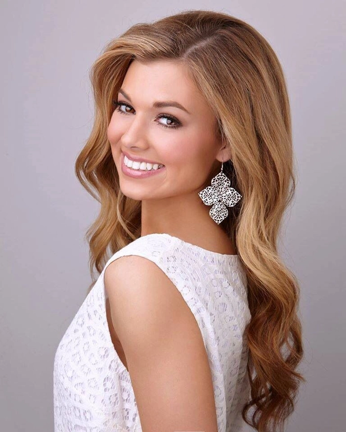Stunning pageant-inspired prom hairstyle showcasing voluminous curls and glam details Elegant pageant style prom hairstyle with soft curls and a sparkling hair accessory
