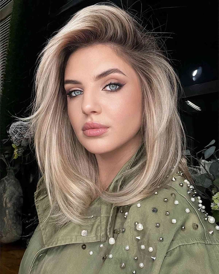 Chic deep side part prom hairstyle for a glamorous look Elegant prom hairstyle featuring a deep side part with soft curls