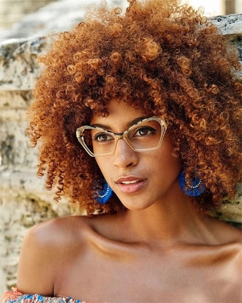 Elegant prom hairstyle featuring soft curls perfect for wearing glasses