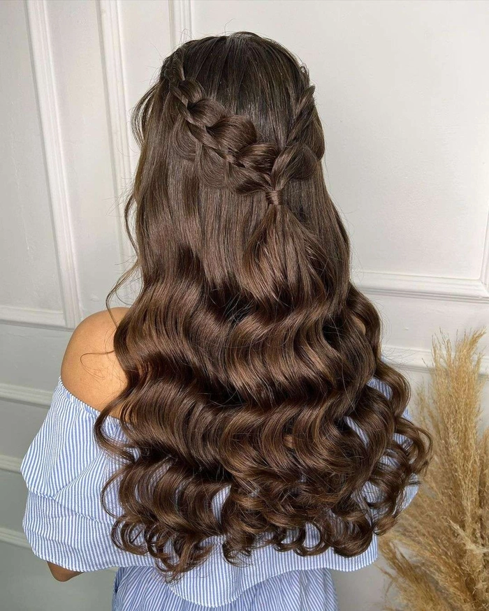 Elegant easy last minute prom hairstyle featuring soft curls and a braided accent
