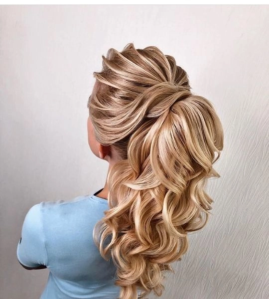 Elegant prom hairstyle with soft curls to match a red dress
