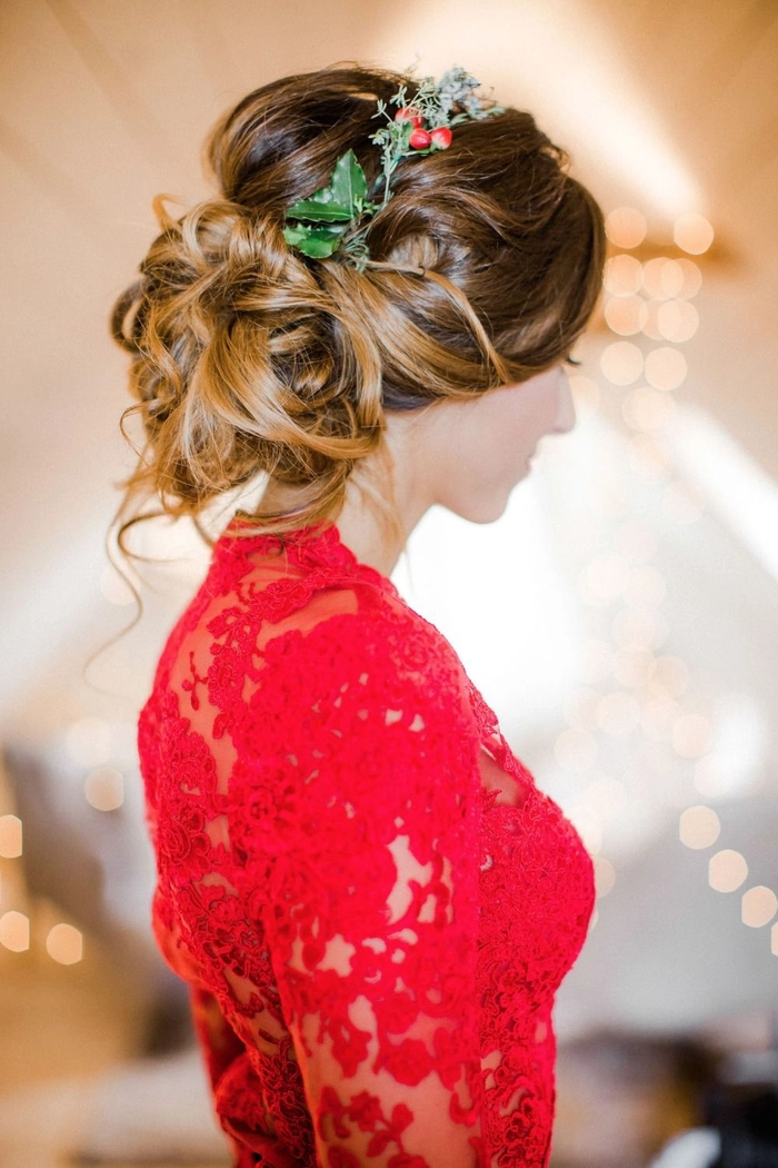 Elegant prom hairstyle featuring soft curls to match a vibrant red dress