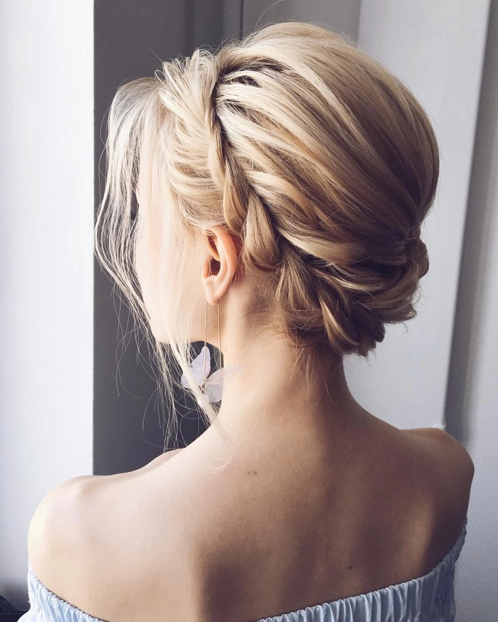 Elegant prom hairstyle complementing a sweetheart neckline gown with soft curls