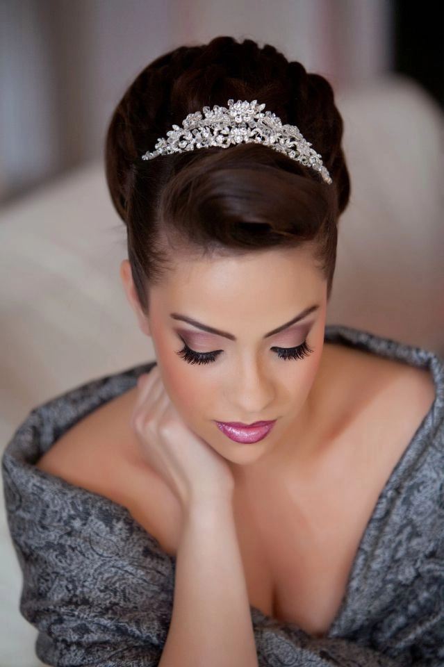 Prom hairstyles with delicate tiaras for a graceful and sparkling look Elegant prom hairstyle featuring a delicate tiara and soft curls