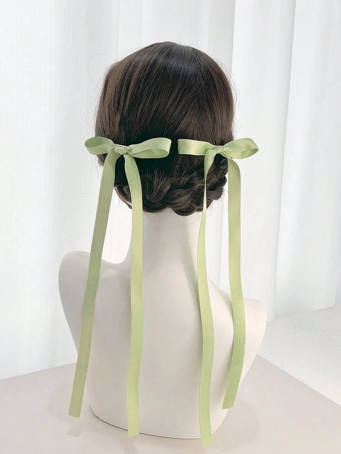 Elegant prom hairstyle featuring velvet ribbons woven into curls