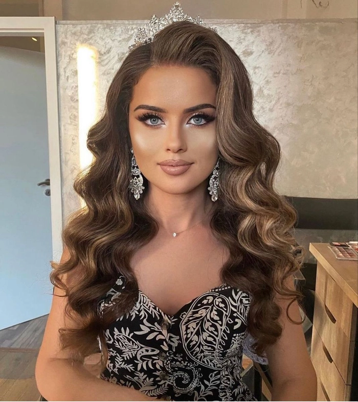Stunning pageant-inspired prom hairstyle featuring soft waves and jeweled embellishments Elegant pageant style prom hairstyles with intricate curls and accessories