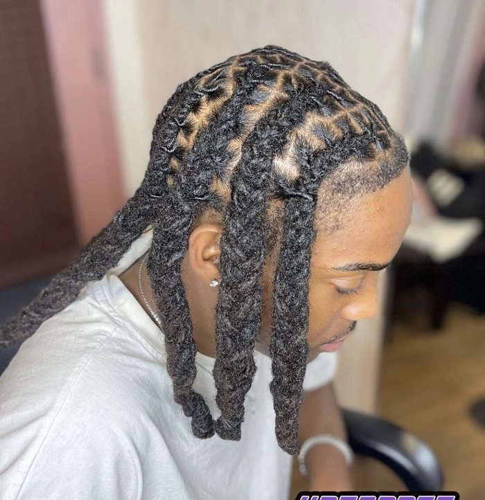 Elegant prom hairstyle for locs with intricate twists and beads
