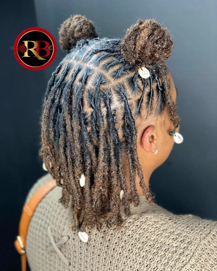 Elegant prom hairstyle for locs featuring intricate twists and decorative beads
