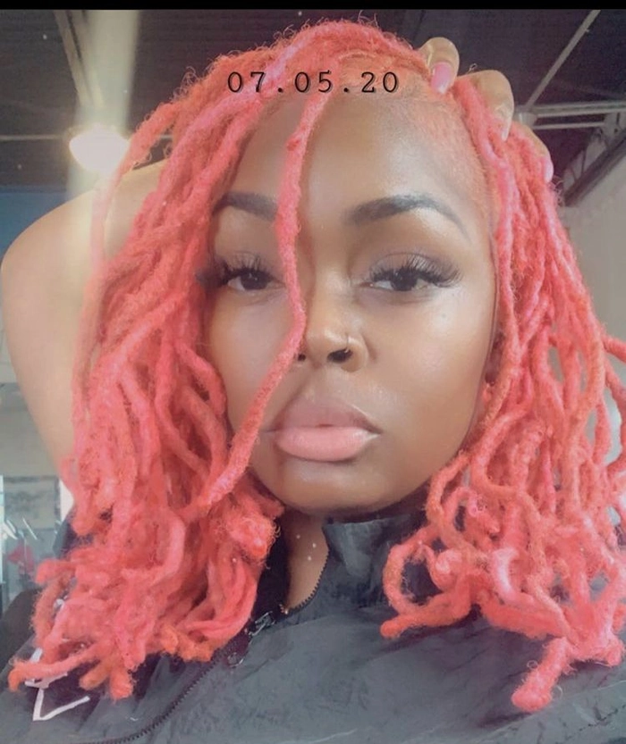 Elegant prom hairstyle for locs with intricate twists and beads