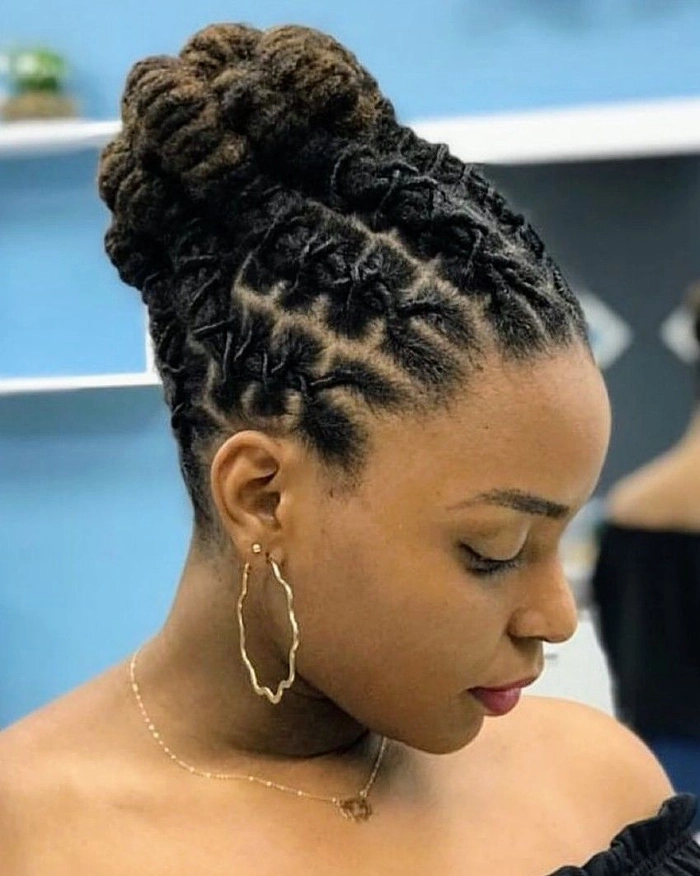 Elegant prom hairstyle showcasing locs styled up with delicate accessories