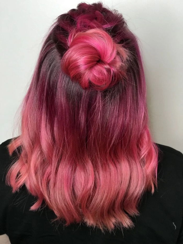 Stunning pastel pink prom hairstyle perfect for a glamorous night out Elegant prom hairstyle showcasing pastel pink dyed hair with soft curls