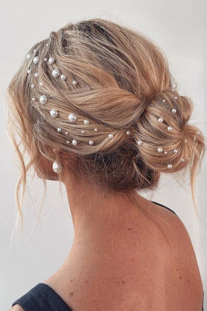 Elegant prom hairstyle featuring pearl hair accessories for a sophisticated look