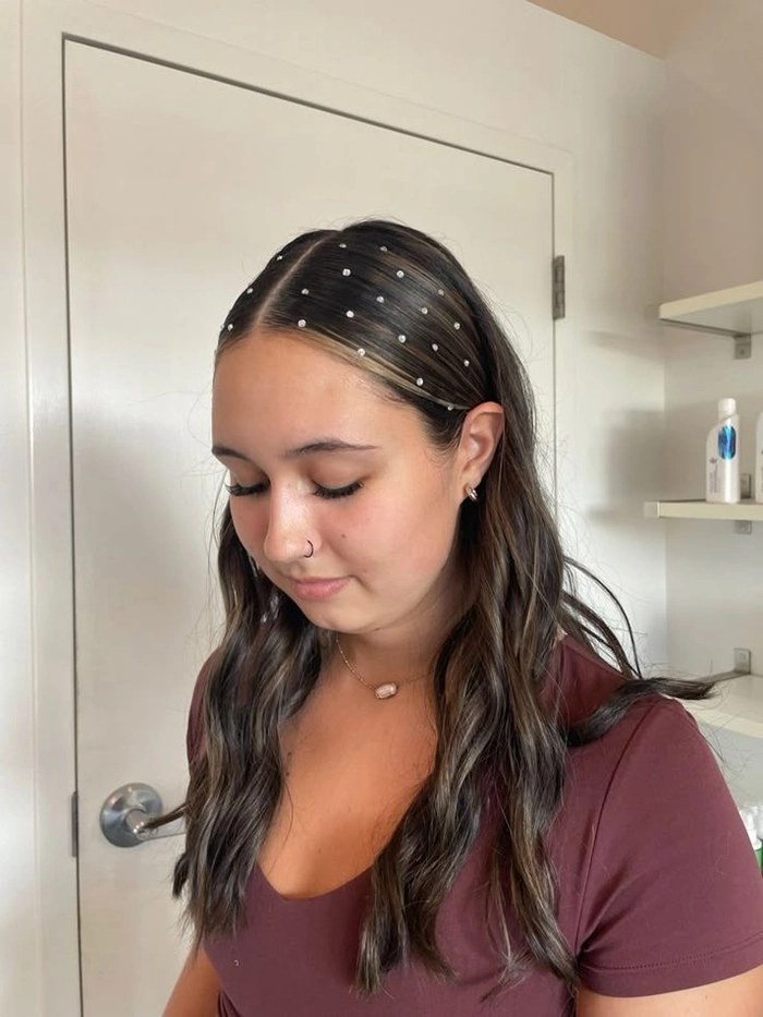 Elegant prom hairstyle featuring pearl hair accessories for a sophisticated look