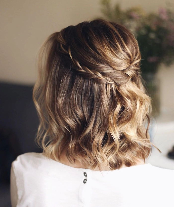 Elegant prom hairstyle featuring a short bob haircut with soft curls and delicate accessories